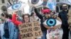 Demonstrators participate in a march and rally to demand President Donald Trump release his tax returns, April 15, 2017, in New York.