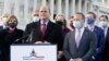 Problem Solvers Caucus co-chairs Rep. Tom Reed, R-N.Y., at podium, and Rep. Josh Gottheimer, D-N.J., right, speak to the media with members of their caucus about the expected passage of the emergency COVID-19 relief bill, Monday, Dec. 21, 2020, on…