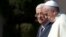 FILE - Pope Francis is welcomed by Palestinian President Mahmoud Abbas upon his arrival to the West Bank city of Bethlehem, May 25, 2014. The Vatican officially recognized the state of Palestine in a new treaty finalized.