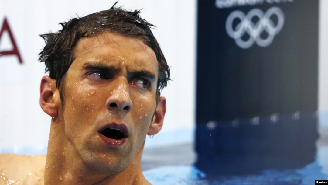 Michael Phelps of the U.S. reacts after finishing in fourth place in the men's 400m individual medley during the London 2012 Olympic Games at the Aquatics Centre July 28, 2012. REUTERS/Michael Dalder (BRITAIN - Tags: SPORT OLYMPICS SPORT SWIMMING) 
