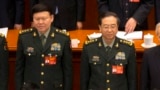2017年3月5日，中共中央军委政治工作部主任张阳（左）与中共中央军委联合参谋部参谋长房峰辉在北京人大会堂参加全国人大会议开幕式。 