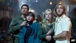 Left to right: Kyle Chandler plays Jackson Lanb, Joel Courtney plays Joe Lamb, Elle Fanning plays Alice Dainard and Ron Eldard plays Louis Dainard in SUPER 8, from Paramount Pictures.