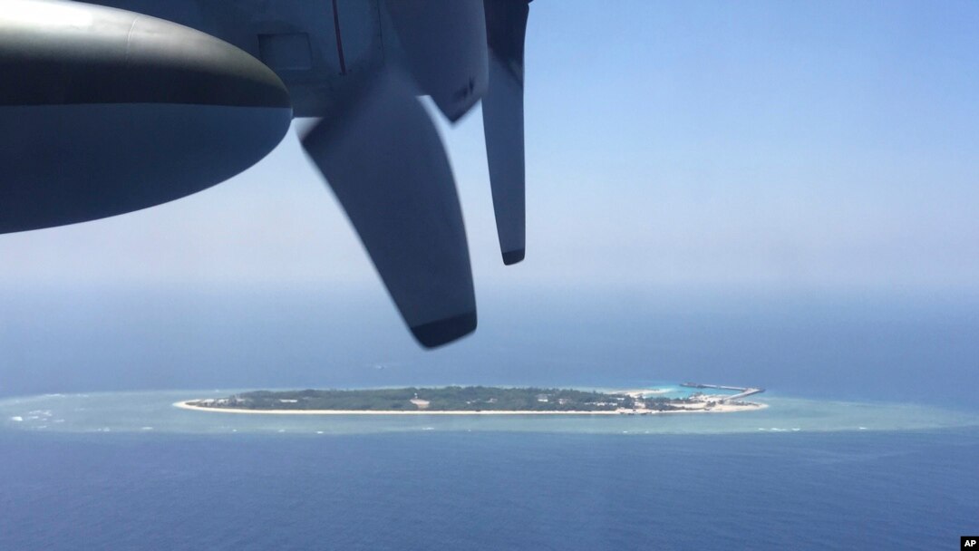 FILE - An aerial view is seen from a military plane carrying international journalists of the Taiwan-controlled Taiping island, also known as Itu Aba, in the Spratly archipelago.