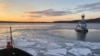 U.S. Coast Guard Cutter Penobscot Bay helps break free tug Stephanie Dann from the ice on the Hudson River near Kingston, New York, U.S. Photo/Handout via REUTERS