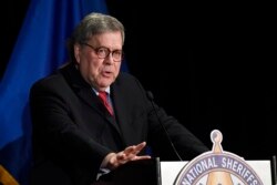 FILE - Attorney General William Barr speaks at the National Sheriffs' Association Winter Legislative and Technology Conference in Washington, Feb. 10, 2020.