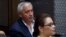 FILE - Former Guatemalan President Otto Perez Molina and his former vice president, Roxanna Baldetti, listen during a court hearing in Guatemala City, May 6, 2016. Twenty-three people had been arrested on charges related to the alleged illegal financing of the political party that carried Perez Molina to power, Guatemalan authorities said.