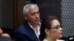 FILE - Guatemala's former President Otto Perez Molina, and his former Vice-President Roxana Baldetti, listen during their court hearing in Guatemala City, May 6, 2016. 