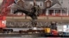 Salvage crews pull up a part of a Black Hawk helicopter near the site of a Jan. 29, 2025, mid-air collision between an American Airlines jet and a Black Hawk helicopter at Ronald Reagan Washington National Airport in Arlington, Virginia, Feb. 6, 2025.