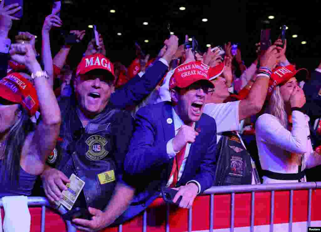 Supporters of Republican presidential nominee and former U.S. President Donald Trump celebrate after the Fox Network called the election in his favor at the site of his rally, at the Palm Beach County Convention Center in West Palm Beach, Florida.