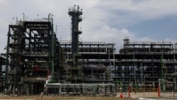 US attorney general asked to reopen probe into Nigeria deal by two oil giants