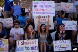 New College of Florida students and supporters protest ahead of a meeting by the college's board of trustees, on the school campus in Sarasota, Fla., Tuesday, Feb. 28, 2023. (AP Photo/Rebecca Blackwell, File)