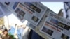 FILE - Newspaper front pages for sale outside a store report on President-elect Donald Trump winning the American election, in Kabul, Afghanistan, Nov. 10, 2016. 