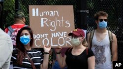 Demonstrators protest near the White House in Washington, June 5, 2020, over the death of George Floyd, a black man who was in police custody in Minneapolis.