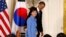 U.S. President Barack Obama and South Korea's President Park Geun-hye depart a joint news conference in the East Room of the White House in Washington, May 7, 2013. 