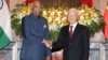 Indian President Ram Nath Kovind, left, shakes hands with Vietnamese President Nguyen Phu Trong before heading for talks behind closed doors in Hanoi, Vietnam, Tuesday, Nov. 20, 2018.