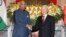 Indian President Ram Nath Kovind, left, shakes hands with Vietnamese President Nguyen Phu Trong before heading for talks behind closed doors in Hanoi, Vietnam, Tuesday, Nov. 20, 2018.