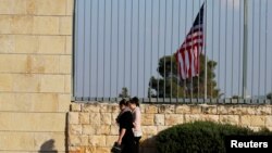 FILE - People walk past the U.S. Consulate in Jerusalem, Feb. 24, 2018. The consulate has been closed since 2019.