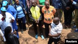 FILE - Chairman of Truth and Reconciliation Commission Pierre Claver Ndayicariye addresses delegates near a 1972 mass grave as they prepare to extract bodies in Gikuzi village, Vugizo commune in Makamba Province, Burundi, Sept. 15, 2020. 