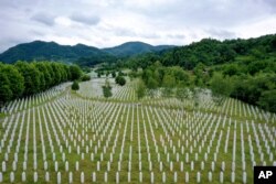 Gravestones are lined up at the memorial cemetery in Potocari, near Srebrenica, Bosnia, July 7, 2020.
