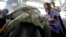 Bank, a 25-year-old green sea turtle, receives treatment at the Chulalongkorn University in Bangkok, Thailand, March 10, 2017. Veterinarians operated on Bank to remove 915 coins which she swallowed after passers-by tossed coins into her pool.