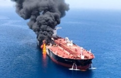 FILE - An oil tanker is seen after it was attacked at the Gulf of Oman, June 13, 2019.