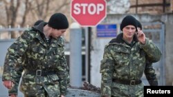 Ukrainian soldiers outside the Ukrainian infantry base in Perevalne, Ukraine, March 12, 2014. 