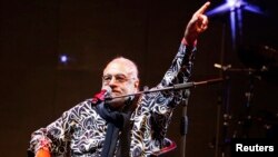 Greek singer Demis Roussos performs at the Edineyat international festival in Ehden town, northern Lebanon, Aug. 10, 2013.