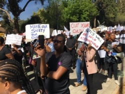 Men and women protest against the abuse of women, in Johannesburg, Sept. 13, 2019. (T.Khumalo/VOA)