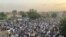 Sudanese people celebrate in the streets of Khartoum after ruling generals and protest leaders announced they have reached an agreement on the disputed issue of a new governing body on July 5, 2019. 