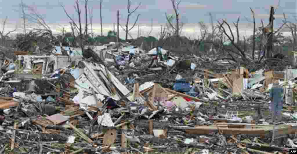 Residents search through what is left of their homes Thursday, April 28, 2011 after a tornado hit Pleasant Grove just west of downtown Birmingham, Ala., Wednesday afternoon. (AP Photo/Butch Dill)