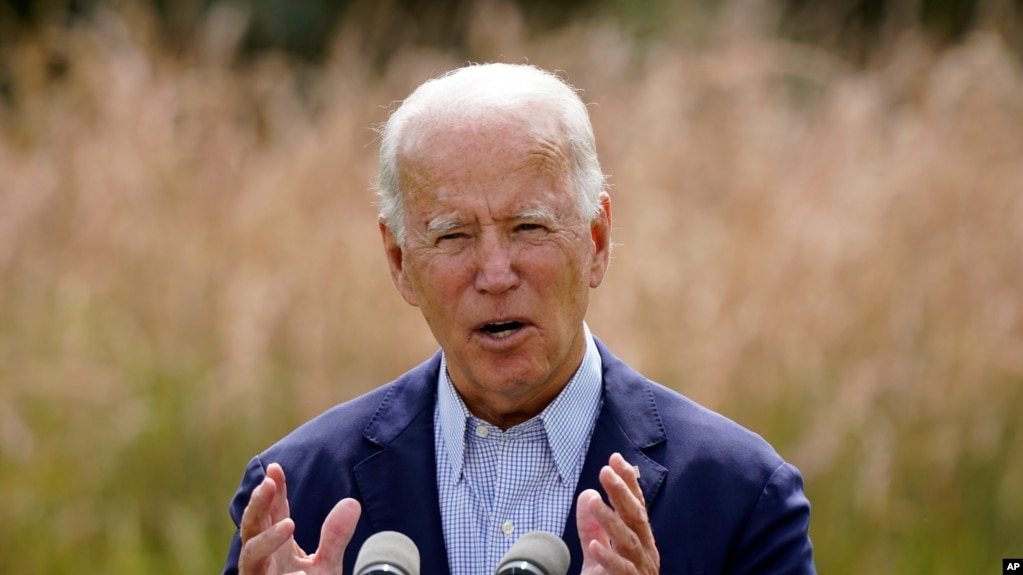 FILE - In this Sept. 14, 2020 file photo, Democratic presidential candidate and former Vice President Joe Biden speaks about climate change and wildfires affecting western states in Wilmington, Del. The United States is out of the Paris climate…