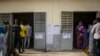 FILE — Senegalese voters line up to cast their ballot at a polling station in Dakar, on February 24, 2019