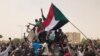 Sudanese shout slogans in a demonstration against the military council, in Khartoum, Sudan, June 30, 2019. Tens of thousands of protesters have taken to the streets in Sudan's capital and elsewhere calling for civilian rule.