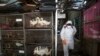 A worker sprays disinfectant as a precaution against the new coronavirus at Chatuchak Market in Bangkok, Thailand, on March 20, 2020. 