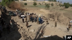 Security personnel arrive at the site of a truck bomb attack in Ghanikhil district, Nangarhar province, east of Kabul, Afghanistan, Oct. 3, 2020.