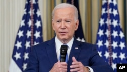 FILE - President Joe Biden answers questions from reporters as he speaks in the State Dining Room of the White House in Washington, Nov. 9, 2022.