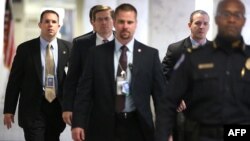 Acting CIA Director Michael Morell (2nd L) arrives Capitol Hill to attend closed-door meetings before the Senate Select Intelligence Committee, Washington, November 15, 2012.