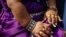 The hands of Jyoti Amge,19, from Nagpur, India, are seen as she arrives on the observation deck of the Empire State Building in New York,USA. Standing 24.7 inches tall, Amge has held the Guinness World Records title for the "Shortest Living Woman" since her 18th birthday on Dec. 16, 2011.