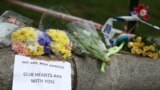 Flowers and messages are left near the scene of an attack by a man driving a car and weilding a knife left five people dead and dozens injured, in London, Britain, March 23, 2017.