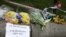 Flowers and messages are left near the scene of an attack by a man driving a car and weilding a knife left five people dead and dozens injured, in London, Britain, March 23, 2017.