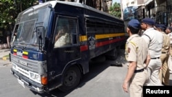 A police van transports some of those convicted in connection with a series of blasts in 1993, outside a court in Mumbai, India, June 16, 2017.