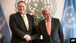 Secretary-General of the U.N. António Guterres, right, greets U.S. Secretary of State Mike Pompeo during his visit to attend a meeting of the U.N. Security Council on the Mideast, Aug. 20, 2019 in New York.