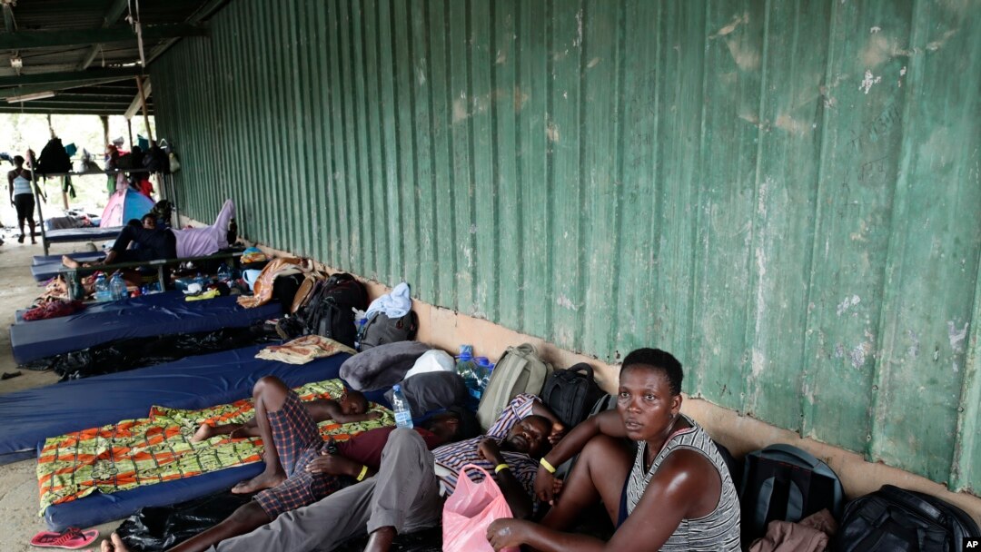 Migrants from several African countries rest outside a barn used as a shelter in Peñitas, Darien Province, Panama, May 10, 2019. African and Asian migrants tend to pay smugglers to shepherd them through the Darien Gap on their journey north to the U.S.
