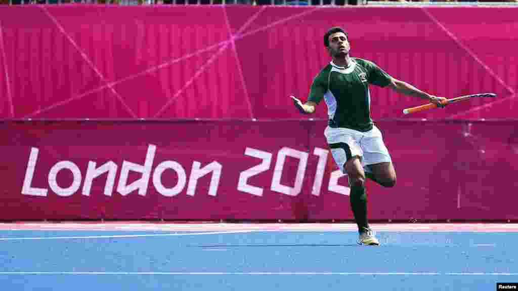 Pakistan's Rehan Butt celebrates his goal during their men's Group A hockey match against Spain at the London 2012 Olympic Games at the Riverbank Arena on the Olympic Park in London July 30, 2012. REUTERS/Kai Pfaffenbach (BRITAIN - Tags: SPORT OLYMPICS S