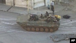 A Syrian army tank is seen in the Zabadani neighborhood of Damascus (file photo).