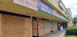 Businesses in the Cambodia Town section of Long Beach, Calif., are boarded up after recent looting touched off by the death of George Floyd. Laura Som, an area resident, says residents and business owners fear looters will return. (Laura Som photo)