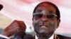 Zimbabwe's President Robert Mugabe addresses the crowd gathered to commemorate Heroes Day in Harare, Aug. 12, 2013. 