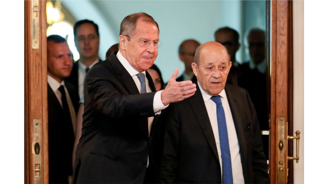 Russian Foreign Minister Sergei Lavrov and his French counterpart Jean-Yves Le Drian arrive for a meeting of the Russian-French Security Cooperation Council in Moscow, Russia, Sept. 9, 2019.