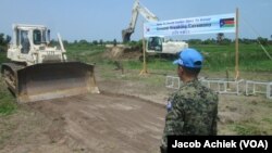 U.N. peacekeepers from South Korea break ground in 2014 in South Sudan's Jonglei state. Bor, the capital, has not suffered seasonal flooding since the 17-kilometer dike was built. 