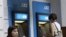 Customers are seen in front of ANZ Bank, Australian and New Zealand Banking Group Ltd., ATM machine. The four largest banks—Acleda, Canadia, ANZ Royal and Cambodia Public—account for 70 percent of deposits and loans.